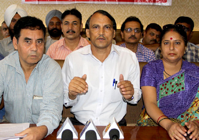 Trade Union leader Babu Hussain addressing press conference in Jammu on Tuesday. — Excelsior/Rakesh Trade Union leader Babu Hussain addressing press conference in Jammu on Tuesday. — Excelsior/Rakesh