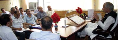 PWD Minister, Abdul Rehman Veeri chairing a meeting at Srinagar on Tuesday. PWD Minister, Abdul Rehman Veeri chairing a meeting at Srinagar on Tuesday.