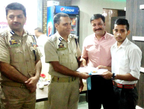DIG, Jammu-Samba-Kathua Range, Ashkoor Wani, felicitating a medal winner of shooting championship. DIG, Jammu-Samba-Kathua Range, Ashkoor Wani, felicitating a medal winner of shooting championship.