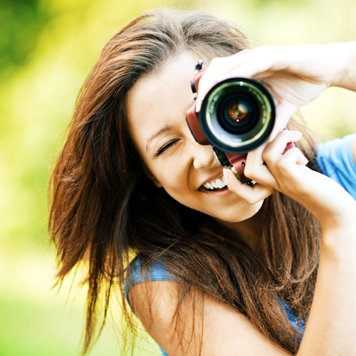 young smiling girl making photo