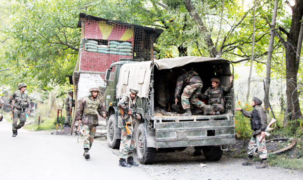 Troops rush to encounter site at Uri on Tuesday. -Excelsior/Aabid Nabi Troops rush to encounter site at Uri on Tuesday. -Excelsior/Aabid Nabi