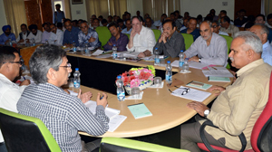 PHE Minister, Sham Lal Choudhary chairing a meeting at Srinagar on Wednesday. PHE Minister, Sham Lal Choudhary chairing a meeting at Srinagar on Wednesday.