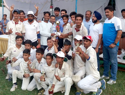Winning team receiving Bhatia Cricket League title trophy from dignitaries at Jammu on Sunday. Winning team receiving Bhatia Cricket League title trophy from dignitaries at Jammu on Sunday.