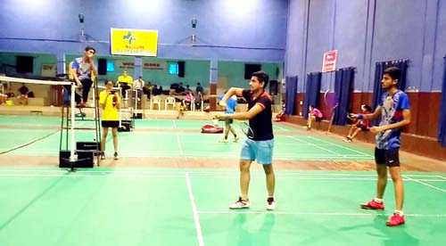 Players in action during District Badminton C’ship. Players in action during District Badminton C’ship.