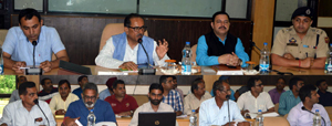DyCM Dr Nirmal Singh chairing a meeting at Reasi on Friday. DyCM Dr Nirmal Singh chairing a meeting at Reasi on Friday.