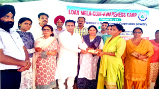 MLA Kathua Rajiv Jasrotia presenting cheque to a beneficiary. MLA Kathua Rajiv Jasrotia presenting cheque to a beneficiary.