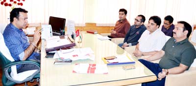 Minister for Food, Civil Supplies and Consumer Affairs Choudhary Zulfkar Ali chairing a meeting in Srinagar on Friday. Minister for Food, Civil Supplies and Consumer Affairs Choudhary Zulfkar Ali chairing a meeting in Srinagar on Friday.