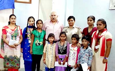 Managing Trustee posing for a group photo with the students participating in scholarship camp. Managing Trustee posing for a group photo with the students participating in scholarship camp.