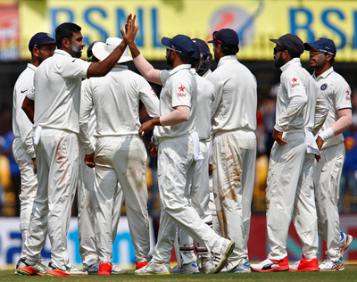 Ravichandran Ashwin celebrates with teammates after the wicket of Ross Taylor on the third day of 3rd and last test match against New Zealand at Holkar Cricket Stadium in Indore on Monday. Ravichandran Ashwin celebrates with teammates after the wicket of Ross Taylor on the third day of 3rd and last test match against New Zealand at Holkar Cricket Stadium in Indore on Monday.