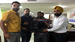 A contractor being provided a gift at a function in Gangyal. A contractor being provided a gift at a function in Gangyal.