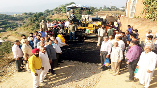 MLA Udhampur Pawan Gupta kick starting work of black topping on Thursday. MLA Udhampur Pawan Gupta kick starting work of black topping on Thursday.