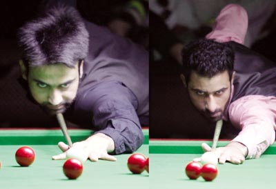 Cueists Younis Kuchey and Mudassar Ashiq in action during summit clash at Billiards Hall, MA Stadium on Tuesday. —Excelsior/Rakesh Cueists Younis Kuchey and Mudassar Ashiq in action during summit clash at Billiards Hall, MA Stadium on Tuesday. —Excelsior/Rakesh