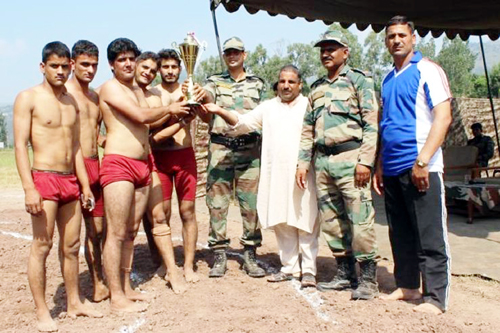 Winning team receiving Wrestling Competition title trophy. Winning team receiving Wrestling Competition title trophy.