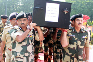 BSF officers carrying body of martyr Sushil Kumar at BSF Headquarters at Paloura. BSF officers carrying body of martyr Sushil Kumar at BSF Headquarters at Paloura.