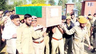 Body of slain cop being received at DPL Kulgam on Saturday. -Excelsior/Younis Khaliq Body of slain cop being received at DPL Kulgam on Saturday. -Excelsior/Younis Khaliq