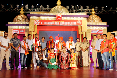 Winners of All India Devotional Song Competition preliminary round posing for group photograph. Winners of All India Devotional Song Competition preliminary round posing for group photograph.