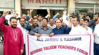 ReTs protesting in front of SSA Project Director’s office at Jammu on Thursday. ReTs protesting in front of SSA Project Director’s office at Jammu on Thursday.