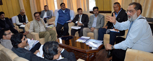 Finance Minister, Dr Haseeb A Drabu chairing a meeting at Jammu on Thursday. Finance Minister, Dr Haseeb A Drabu chairing a meeting at Jammu on Thursday.