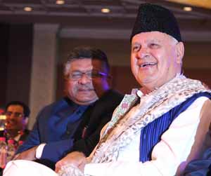 NEW DELHI, DEC 7 Union Minister for Law and Justice Ravi Shankar Prasad and National Conference leader Farooq Abdullah at 'Agenda Aaj Tak', in New Delhi on Wednesday. (UNI) NEW DELHI, DEC 7 Union Minister for Law and Justice Ravi Shankar Prasad and National Conference leader Farooq Abdullah at 'Agenda Aaj Tak', in New Delhi on Wednesday. (UNI)