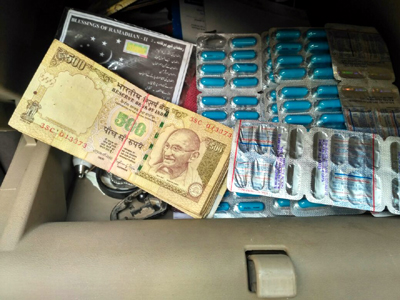 Old currency notes and banned capsules seized by police at Lakhanpur on Sunday. Old currency notes and banned capsules seized by police at Lakhanpur on Sunday.