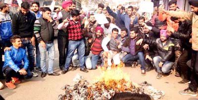 PYC activists staging protest against BJP in Jammu on Friday. -Excelsior/ Rakesh PYC activists staging protest against BJP in Jammu on Friday. -Excelsior/ Rakesh