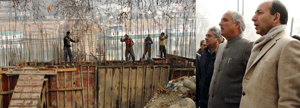 Minister for R&B A R Veeri inspecting developmental work in Srinagar on Monday. Minister for R&B A R Veeri inspecting developmental work in Srinagar on Monday.