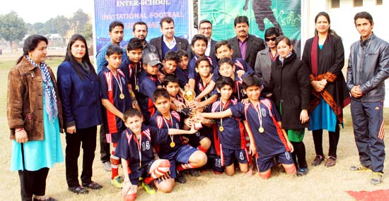 Winner of Invitational Football Tournament posing for group photograph. Winner of Invitational Football Tournament posing for group photograph.