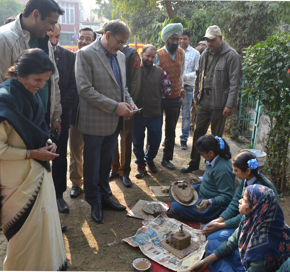 Speaker Legislative Assembly Kavinder Gupta observing the students skill during Clay Modeling Competition at Jammu on Monday. Speaker Legislative Assembly Kavinder Gupta observing the students skill during Clay Modeling Competition at Jammu on Monday.