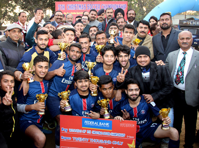 Jubilant Vijay Club team posing alongwith ADGP Dilbag Singh and other dignitaries after winning 5th Christmas Soccer Championship in Jammu. -Excelsior/Rakesh Jubilant Vijay Club team posing alongwith ADGP Dilbag Singh and other dignitaries after winning 5th Christmas Soccer Championship in Jammu. -Excelsior/Rakesh