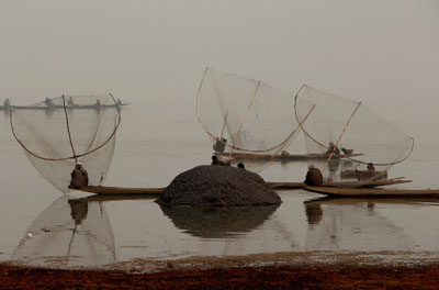 Fishermen fishing in Wullar lake. Fishermen fishing in Wullar lake.