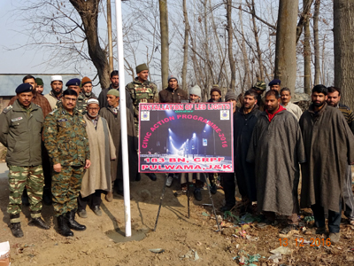 CRPF personnel and locals during LED lights installation function. CRPF personnel and locals during LED lights installation function.
