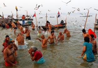 Hindu devotees take a dip at Sangam, a confluence of three rivers, the Ganga, the Yamuna and the mythical Saraswati, on the occasion of Hindu devotees take a dip at Sangam, a confluence of three rivers, the Ganga, the Yamuna and the mythical Saraswati, on the occasion of
