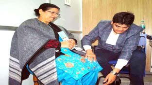 A doctor examining a patient during a free orthopedics health check-up camp at Jammu on Sunday. A doctor examining a patient during a free orthopedics health check-up camp at Jammu on Sunday.