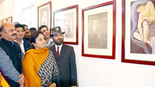 Minister of State for Culture and Tourism Priya Sethi looking at art work during an exhibition. Minister of State for Culture and Tourism Priya Sethi looking at art work during an exhibition.