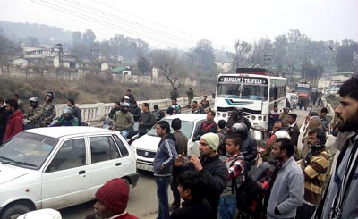 Villagers block National Highway in Udhampur on Tuesday. Villagers block National Highway in Udhampur on Tuesday.