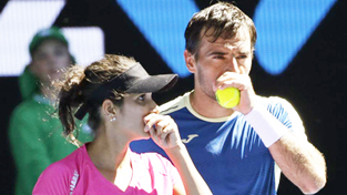 Sania Mirza, left, and partner Ivan Dodig of Croatia chat during their mixed doubles semifinal against Australians Samantha Stosur and Sam Groth at the Australian Open Tennis Championships in Melbourne on Friday. Sania Mirza, left, and partner Ivan Dodig of Croatia chat during their mixed doubles semifinal against Australians Samantha Stosur and Sam Groth at the Australian Open Tennis Championships in Melbourne on Friday.