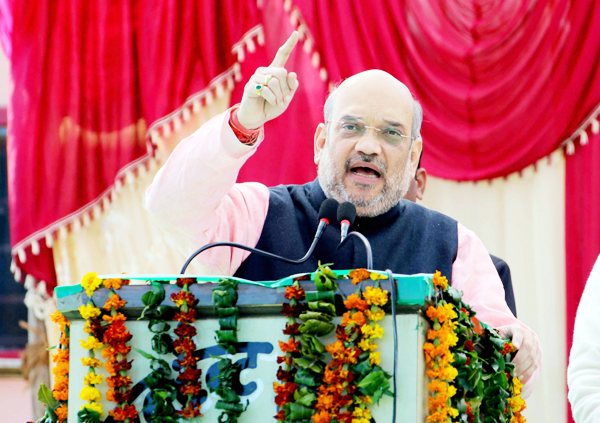 BJP National President Amit Shah addressing an election rally at Bauradi Stadium, in New Tehri in Uttarakhand on Thursday. (UNI) BJP National President Amit Shah addressing an election rally at Bauradi Stadium, in New Tehri in Uttarakhand on Thursday. (UNI)
