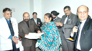 Minister of Health Bali Bhagat felicitating a long surviving cancer patient at GMC Jammu on Saturday. Principal GMC Dr Zahid A Gillani and HoD Oncology Department Prof Ashutosh Gupta are also seen in the picture. Minister of Health Bali Bhagat felicitating a long surviving cancer patient at GMC Jammu on Saturday. Principal GMC Dr Zahid A Gillani and HoD Oncology Department Prof Ashutosh Gupta are also seen in the picture.