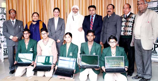 Students of SP Smart School holding Laptops presented to them during a function on Saturday. Students of SP Smart School holding Laptops presented to them during a function on Saturday.