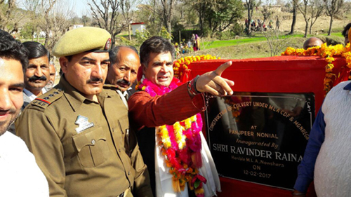 MLA Ravinder Raina during inauguration of mini bridge at Upper Nonial village in Nowshera constituency. MLA Ravinder Raina during inauguration of mini bridge at Upper Nonial village in Nowshera constituency.