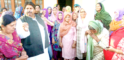 Cong leader Raman Bhalla listening grievances of public at Barjala in Gandhinagar on Sunday. Cong leader Raman Bhalla listening grievances of public at Barjala in Gandhinagar on Sunday.