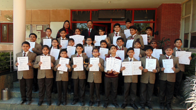 Meritorious students of Jodhamal holding certificates while posing for a group photograph. Meritorious students of Jodhamal holding certificates while posing for a group photograph.