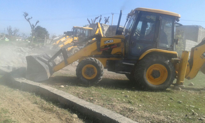 JCB of JDA removing encroachment in Majeen Sidhra on Saturday.