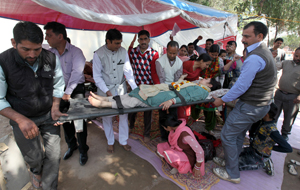 Protesting contractual lecturers shifting one of their colleagues to GMC Hospital. -Excelsior/Rakesh Protesting contractual lecturers shifting one of their colleagues to GMC Hospital. -Excelsior/Rakesh