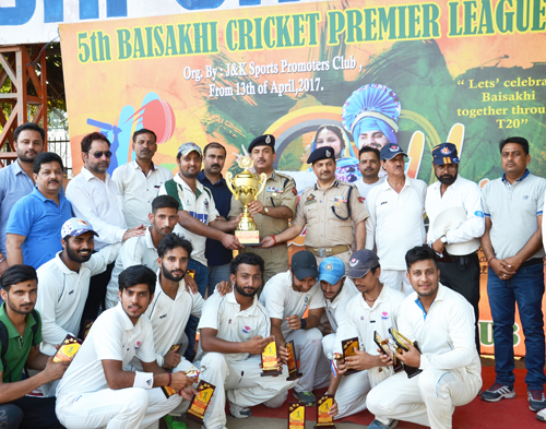 Skipper KC Sports Club Arjun Choudhary receiving trophy from IGP Jammu, SD Singh Jamwal alongwith his team members and other dignitaries and officials in Jammu on Monday. Skipper KC Sports Club Arjun Choudhary receiving trophy from IGP Jammu, SD Singh Jamwal alongwith his team members and other dignitaries and officials in Jammu on Monday.
