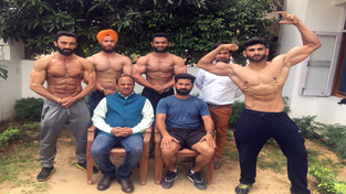 5-members J&K Body building team posing for a group photograph alongwith dignitaries in Jammu on Thursday.