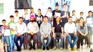 Winners of Chess events posing for a group photograph along with office bearers and officials in Jammu on Thursday. Winners of Chess events posing for a group photograph along with office bearers and officials in Jammu on Thursday.