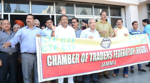 Traders protesting outside Commercial Taxes office in Jammu on Monday. Traders protesting outside Commercial Taxes office in Jammu on Monday.