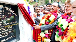 Minister for Rural Development & Panchayati Raj, Abdul Haq, laying foundation stone of model village in Keran area of Kupwara on Sunday. Minister for Rural Development & Panchayati Raj, Abdul Haq, laying foundation stone of model village in Keran area of Kupwara on Sunday.