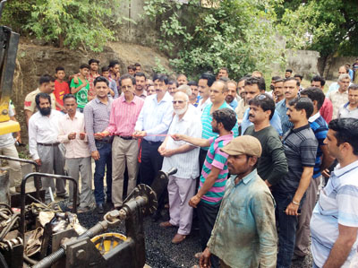 MLA Udhampur Pawan Gupta launching black topping of road on Thursday. MLA Udhampur Pawan Gupta launching black topping of road on Thursday.